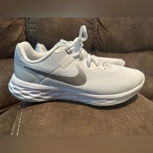 Women’s white Nike running shoes